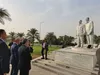 ادای احترام عراقچی به شهیدان سردار سلیمانی و ابومهدی المهندس