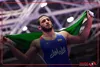 اهتزاز پرچم ایران پس از کسب مدال طلای امیرعلی آذرپیرا در مسابقات کشتی بازی های آسیایی ۲۰۲۶ ناگویا