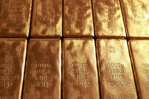 Global gold prices edge up as weaker U.S. dollar provides support