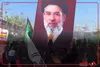 پرچم ایران و تصویر رهبر انقلاب بر دوش نیروهای امنیتی عراق